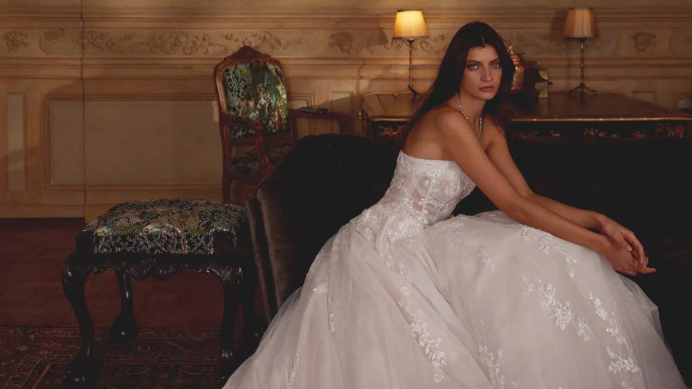 Model wearing a gown by Justin Alexander
